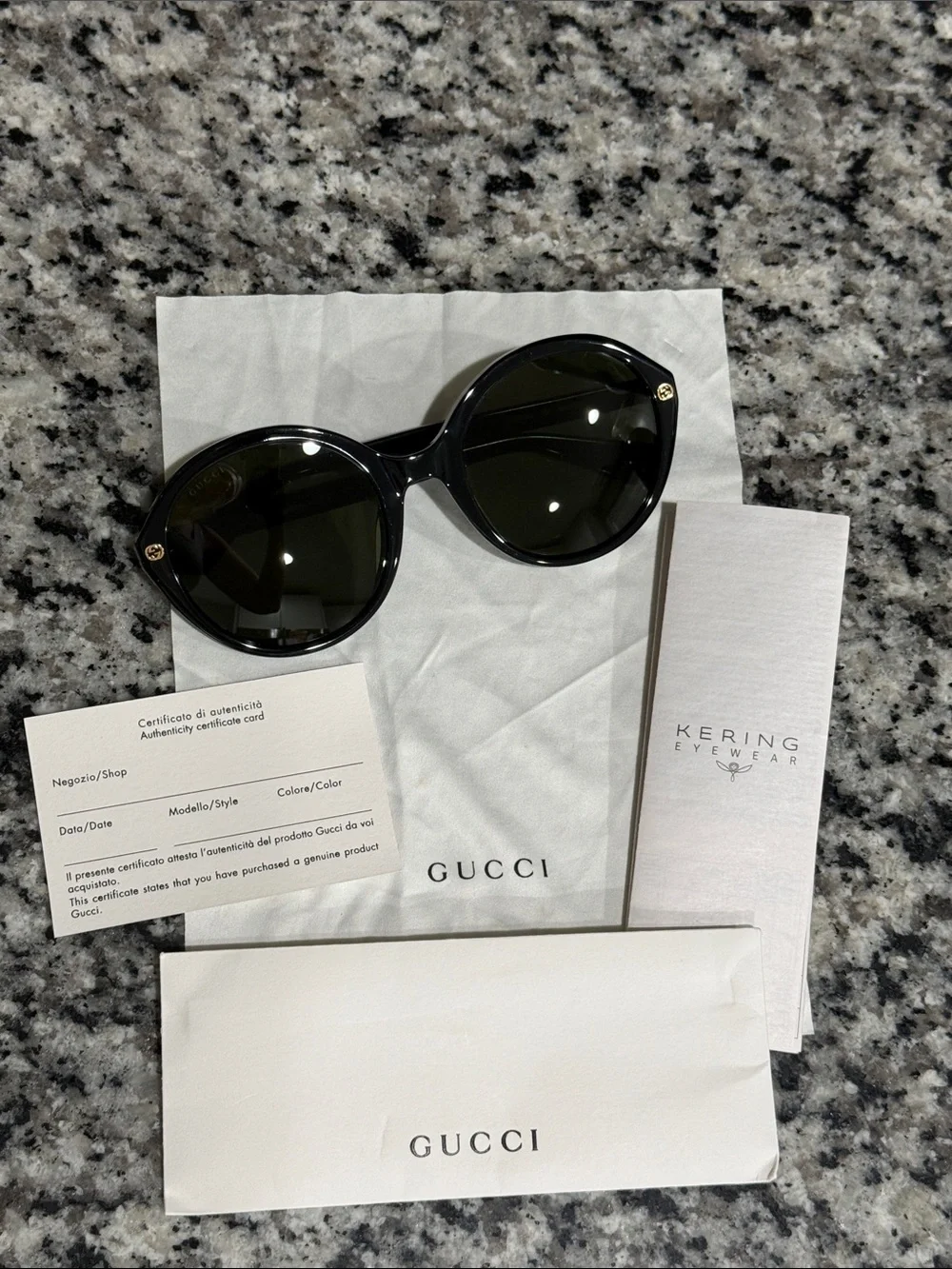 Gucci Women’s Black Round Sunglasses with Gold Accent